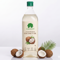A 1-liter bottle of Farmseed cold pressed coconut oil, displayed on a reflective white surface with whole and halved coconuts and a green palm leaf.